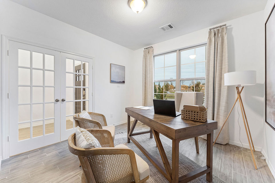 A room with a table and chairs.