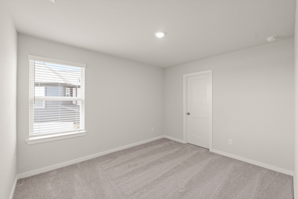 A room with a door and a window.