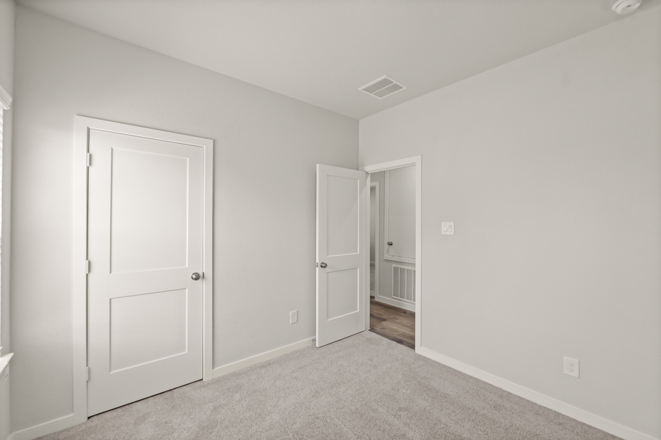 A room with white doors.