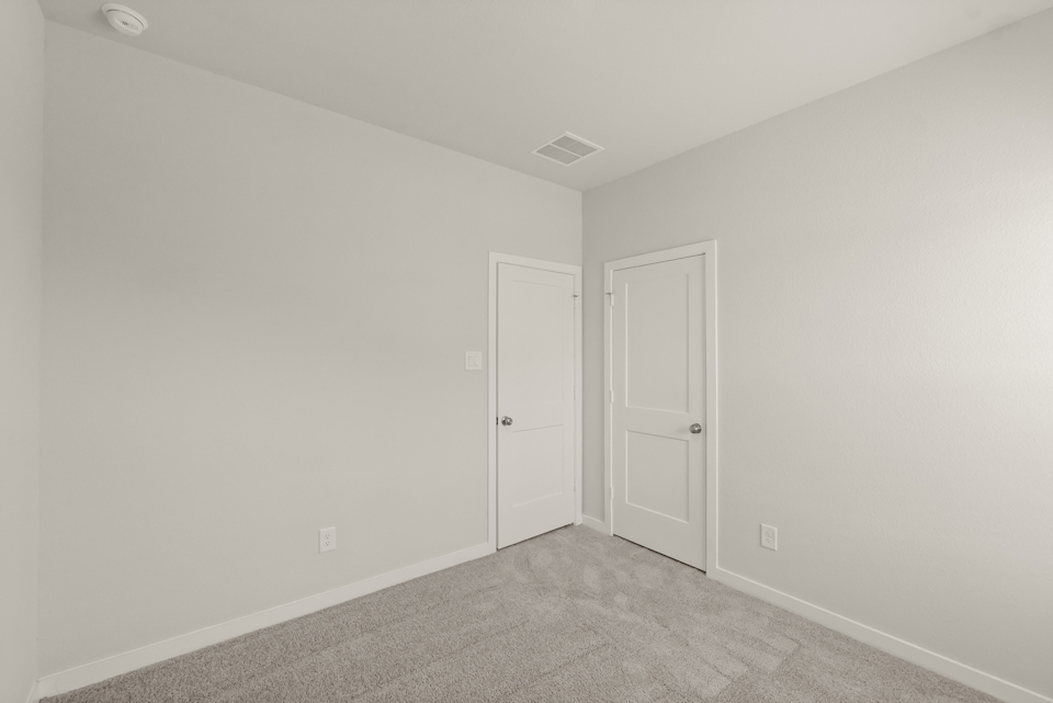 A room with white doors.