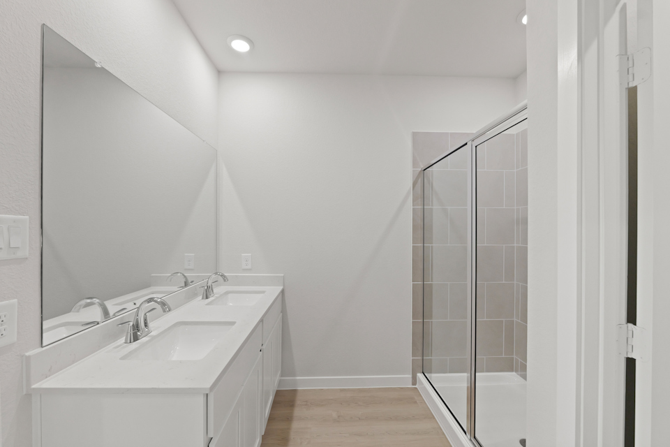 A bathroom with a glass shower.