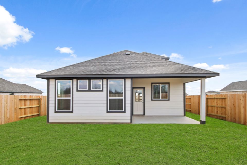 A house with a grass yard.