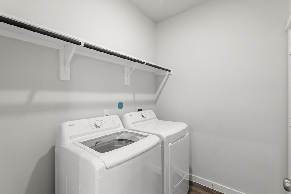 A washing machine in a room.