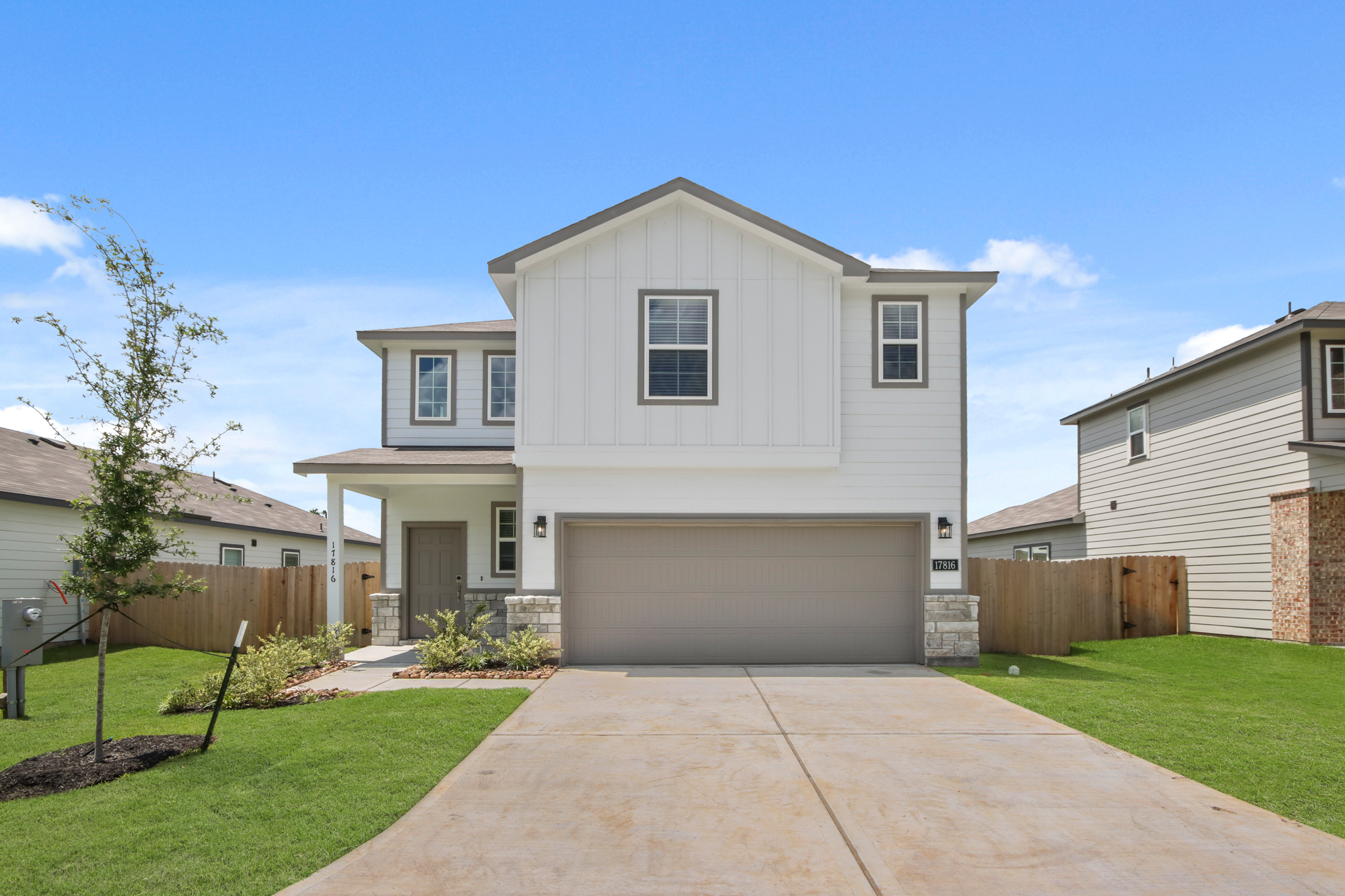 A white house with a driveway.