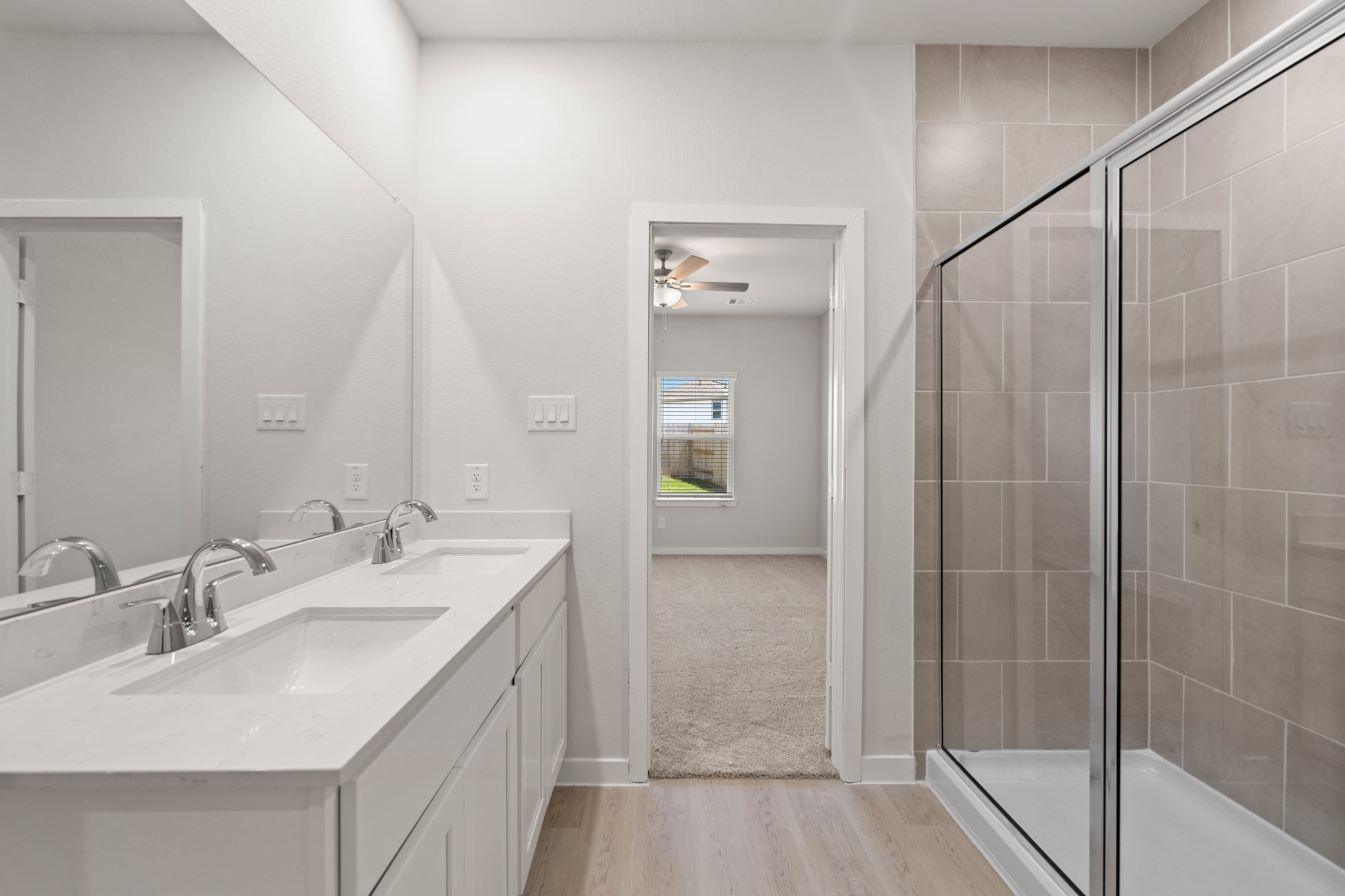 A bathroom with a glass shower.