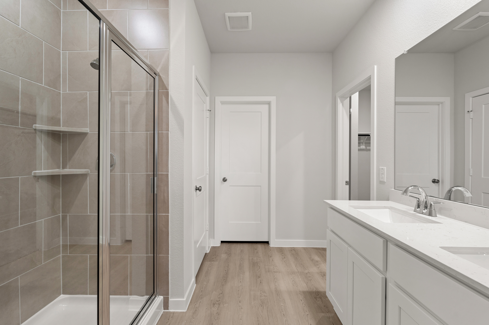 A bathroom with a glass shower.