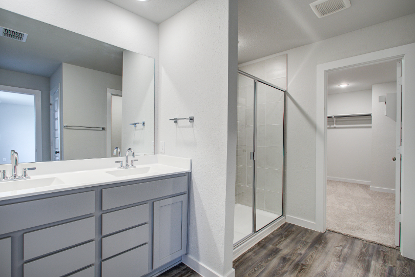 A bathroom with a glass shower.