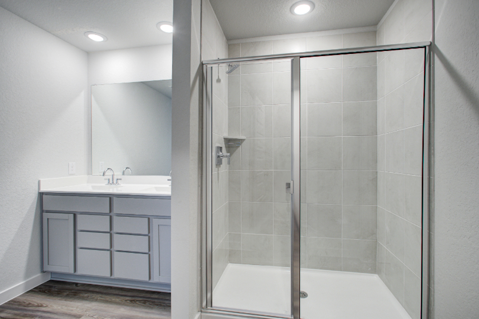 A bathroom with a glass shower.