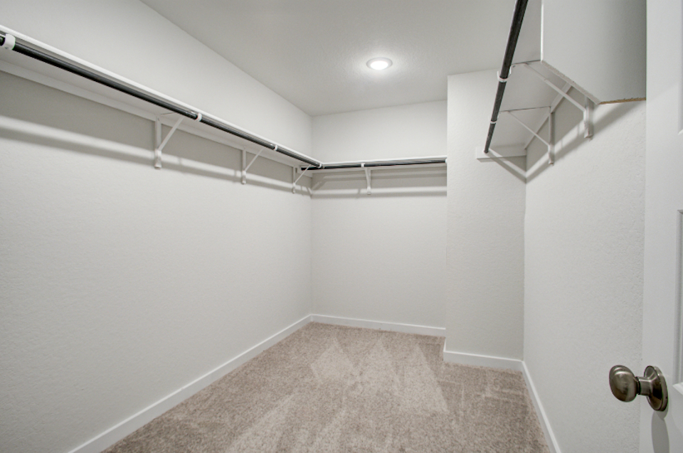 A hallway with white walls.