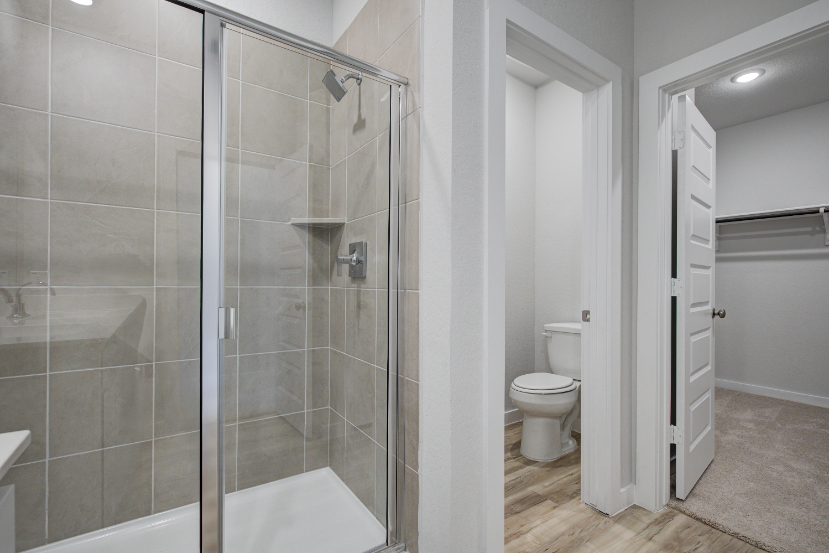 A bathroom with a glass shower.