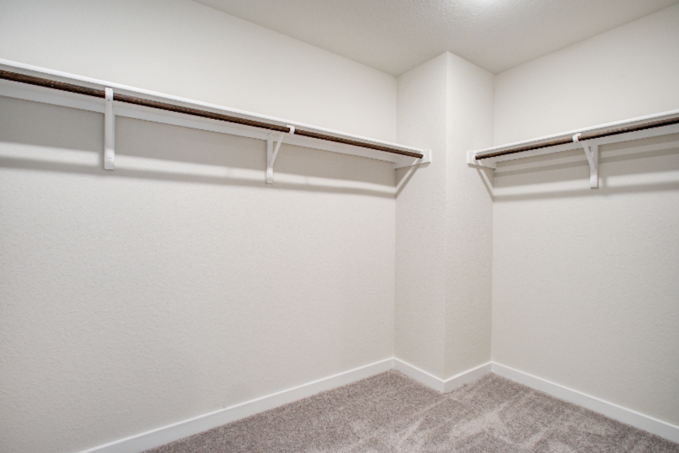 A white room with a carpet.