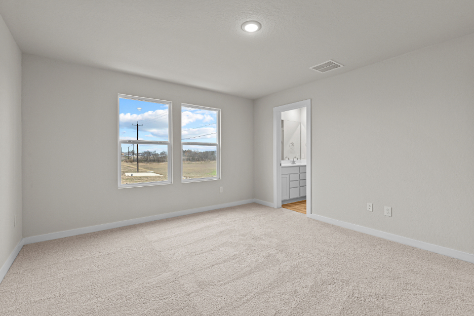 A room with a window and a door.