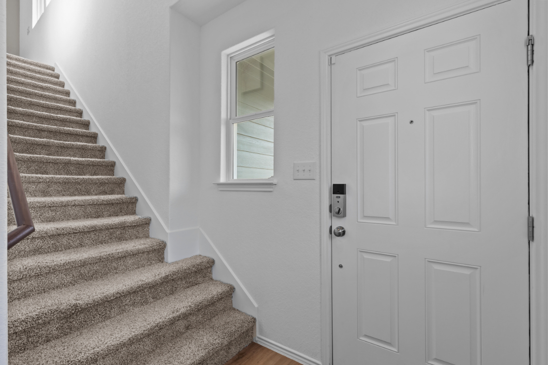 A staircase leading to a door.