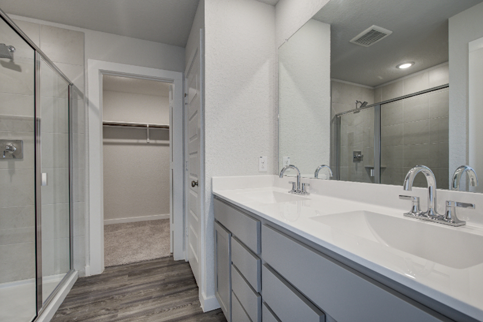 A bathroom with a glass shower.
