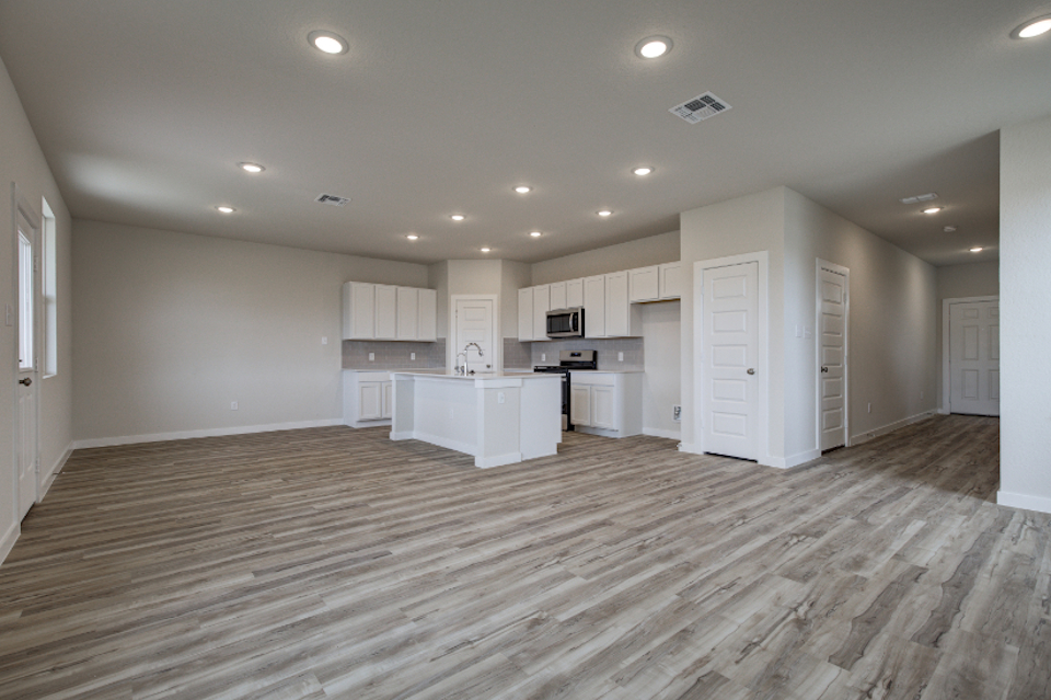 A large kitchen with white cabinets.