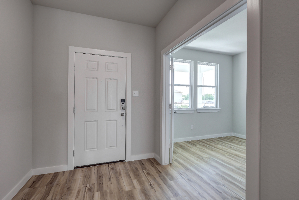 A room with a white door and a white door.