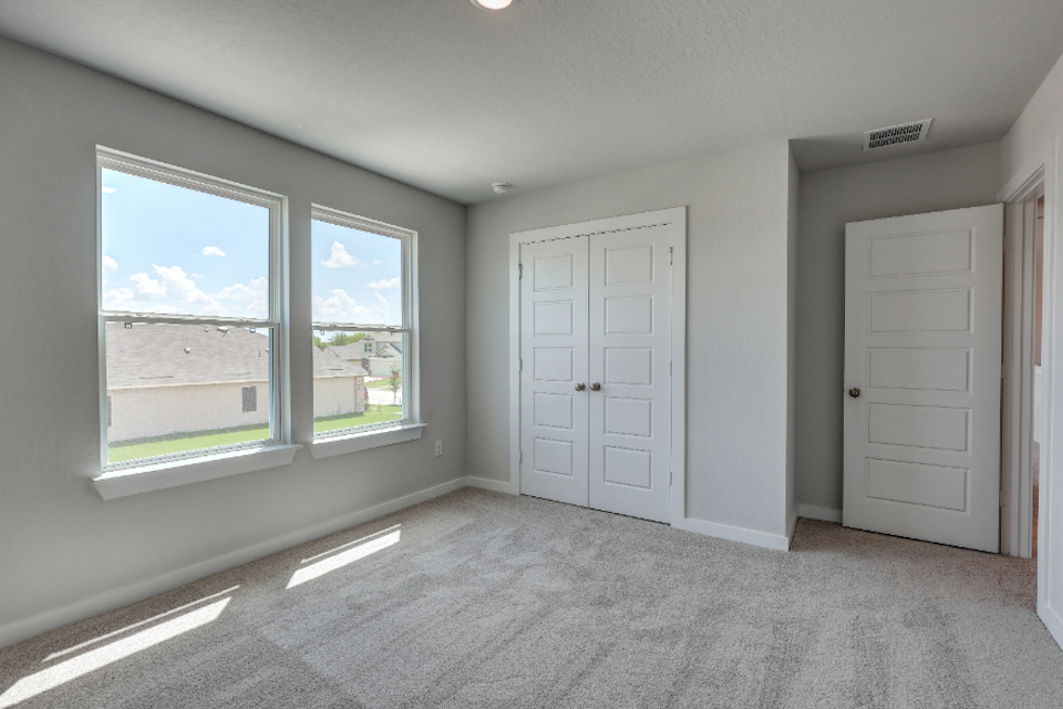 A room with white doors and windows.