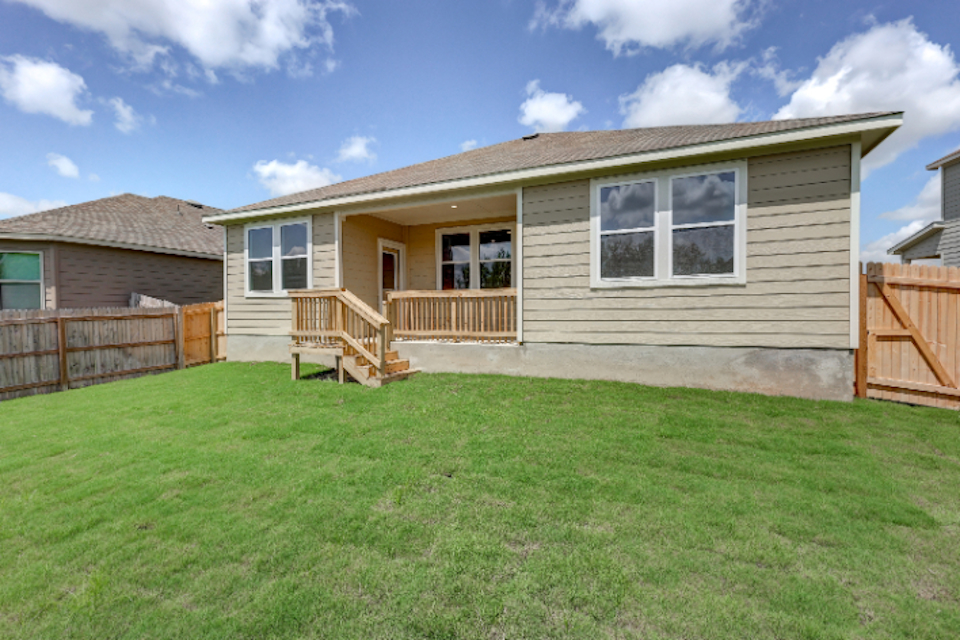 A house with a grass yard.