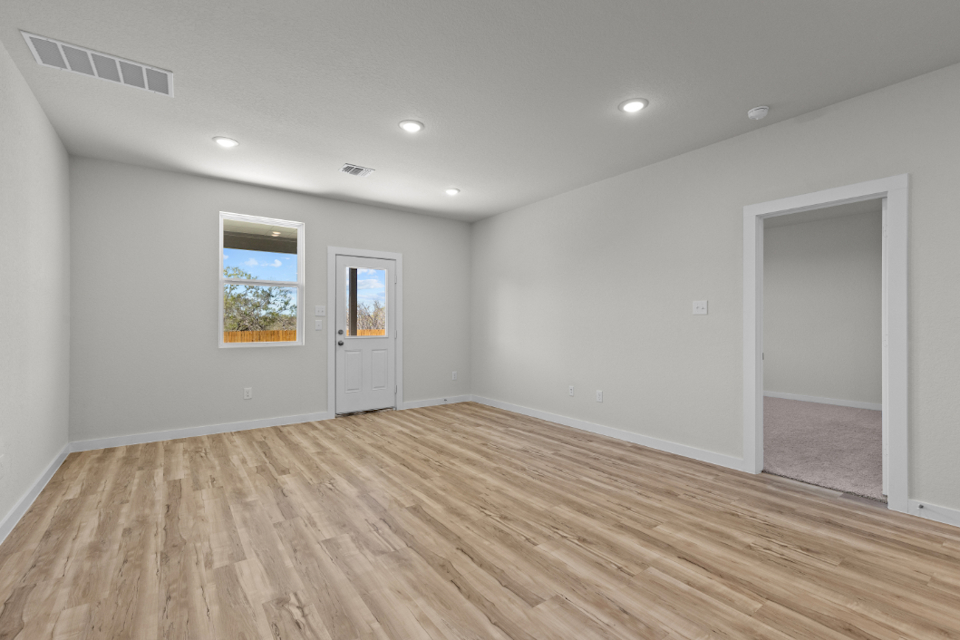 A room with a wood floor and a wood floor.