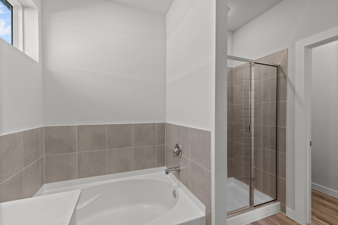 A bathroom with a glass shower.