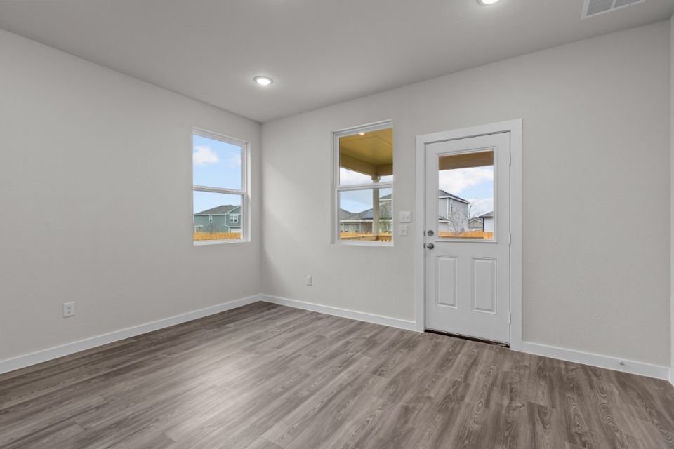 A room with a door and windows.