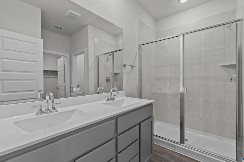 A bathroom with a glass shower.