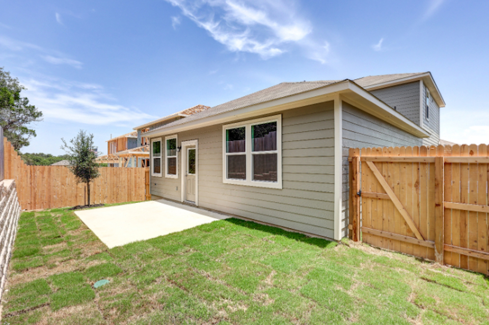 A house with a fence around it.