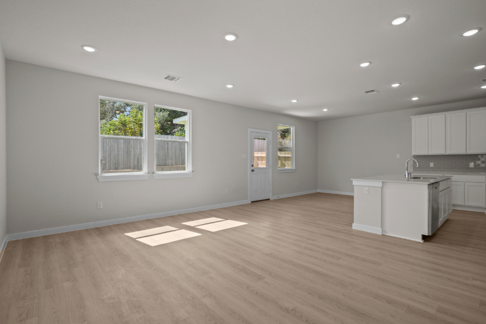 A large kitchen with white cabinets.