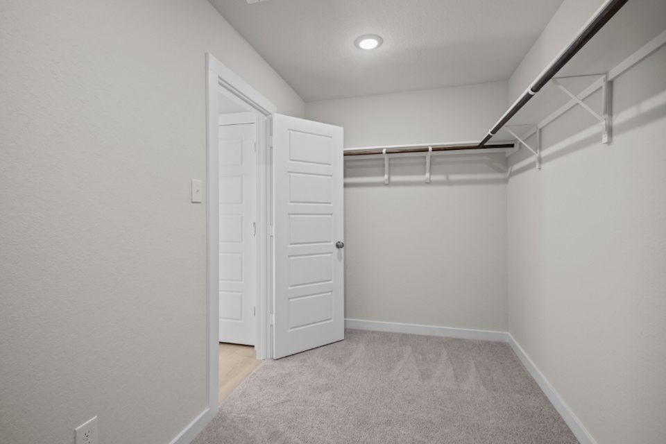 A hallway with white doors.