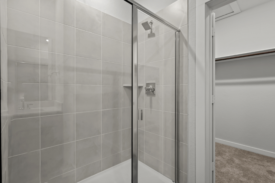 A shower with glass doors.