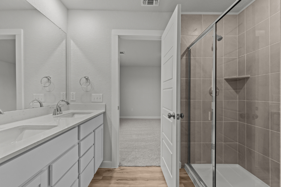 A bathroom with a glass shower.