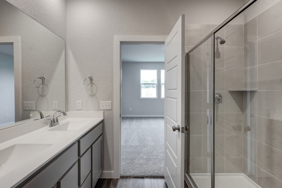 A bathroom with a glass shower.