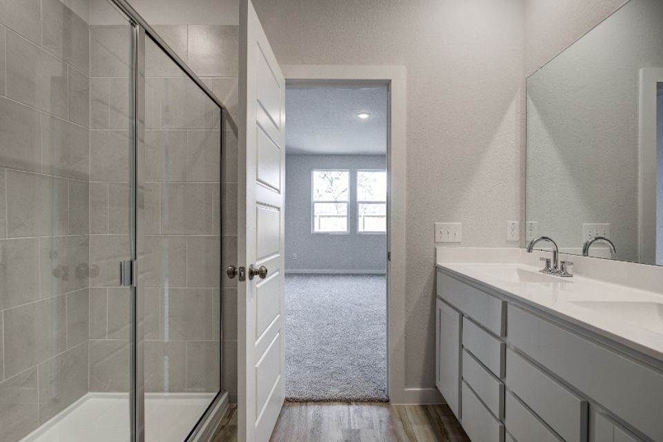 A bathroom with a glass shower.
