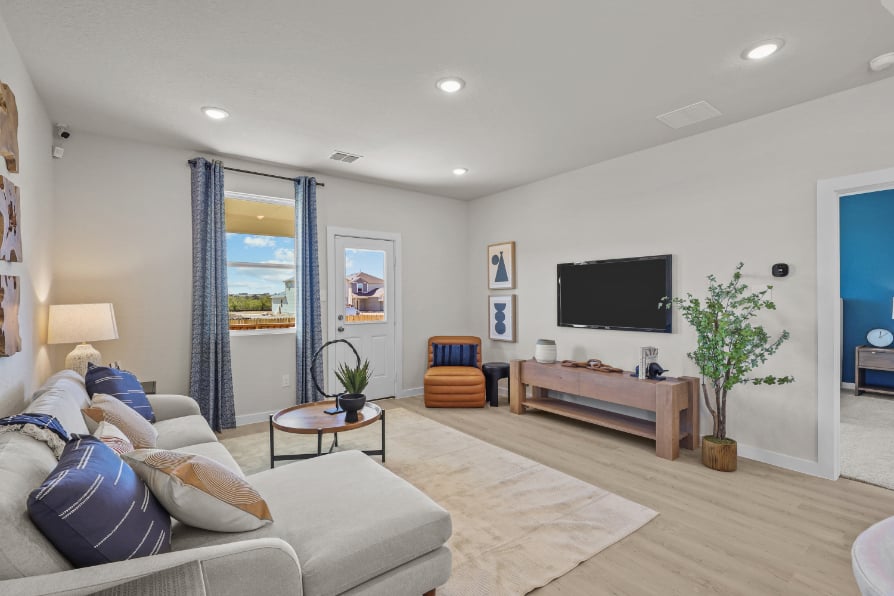 A living room with a tv and couches.