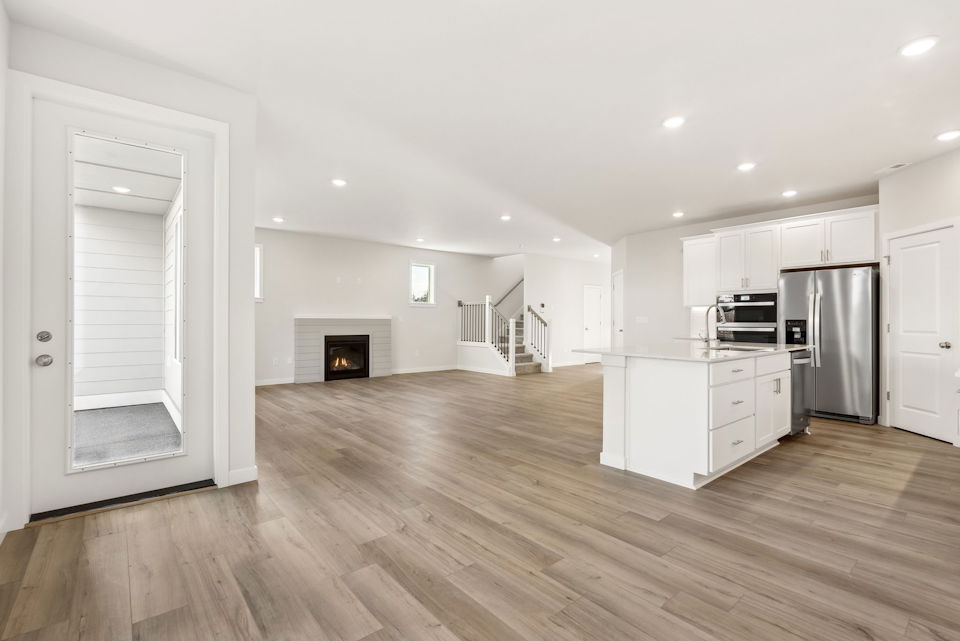 A large kitchen with white cabinets.