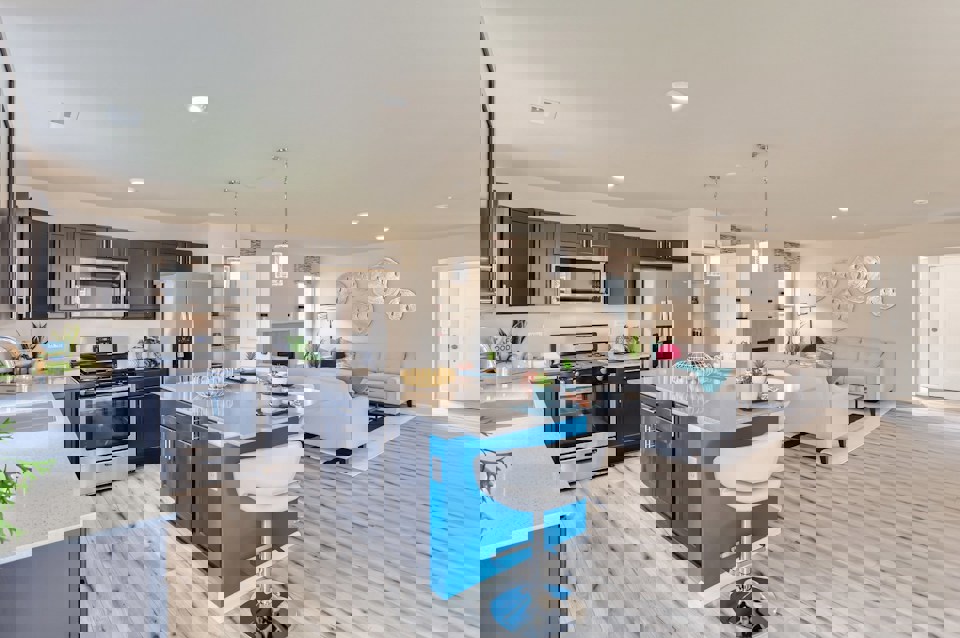 A kitchen with a bar and a table.