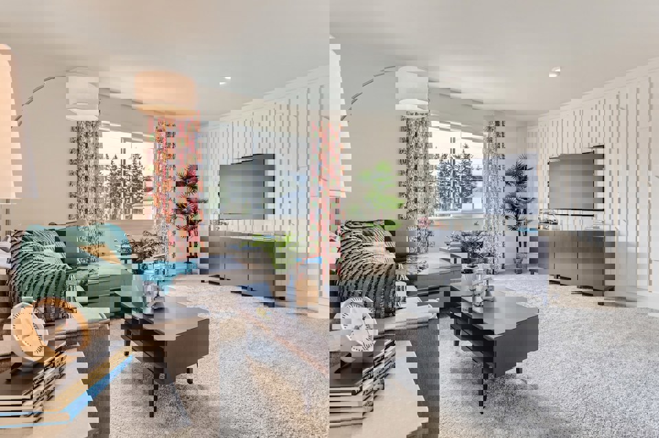 A living room with a tv and couches.