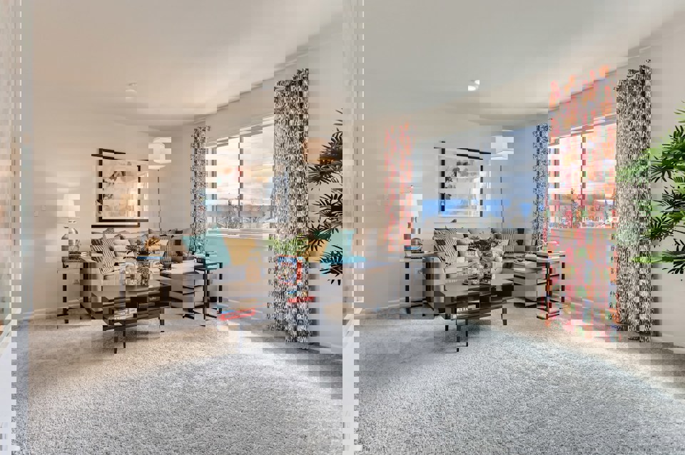 A living room with a large window.