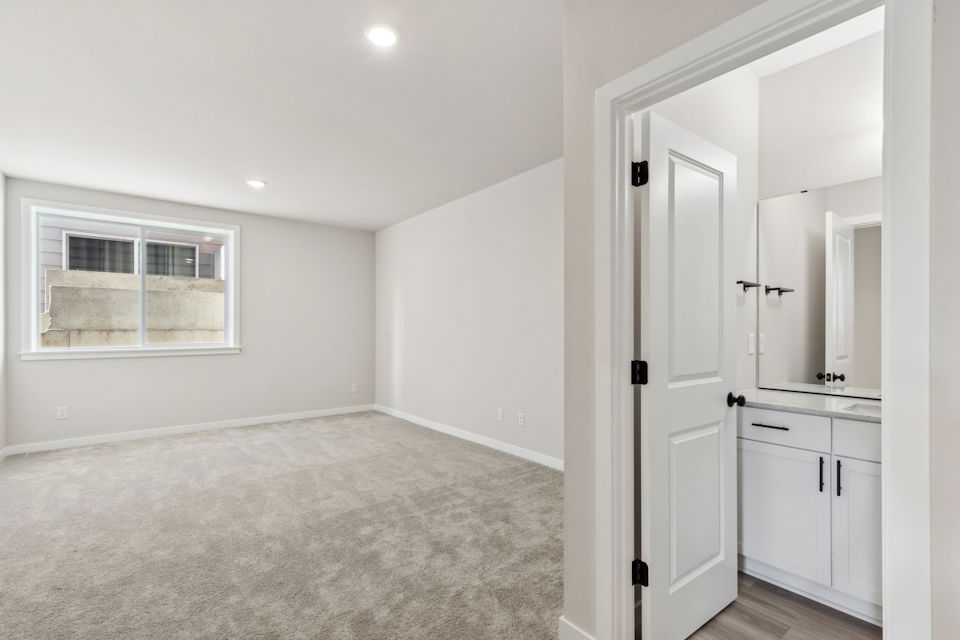 A room with white walls and a white door.