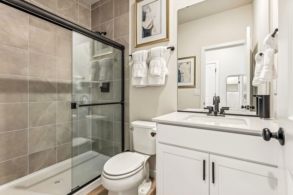 A bathroom with a glass shower.
