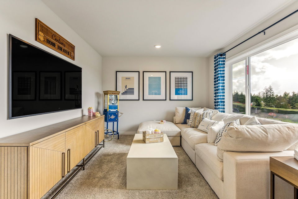 A living room with a tv and couches.