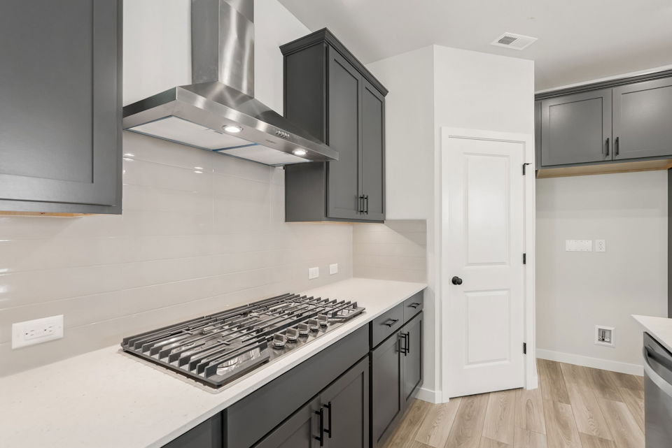 A kitchen with a stove and oven.