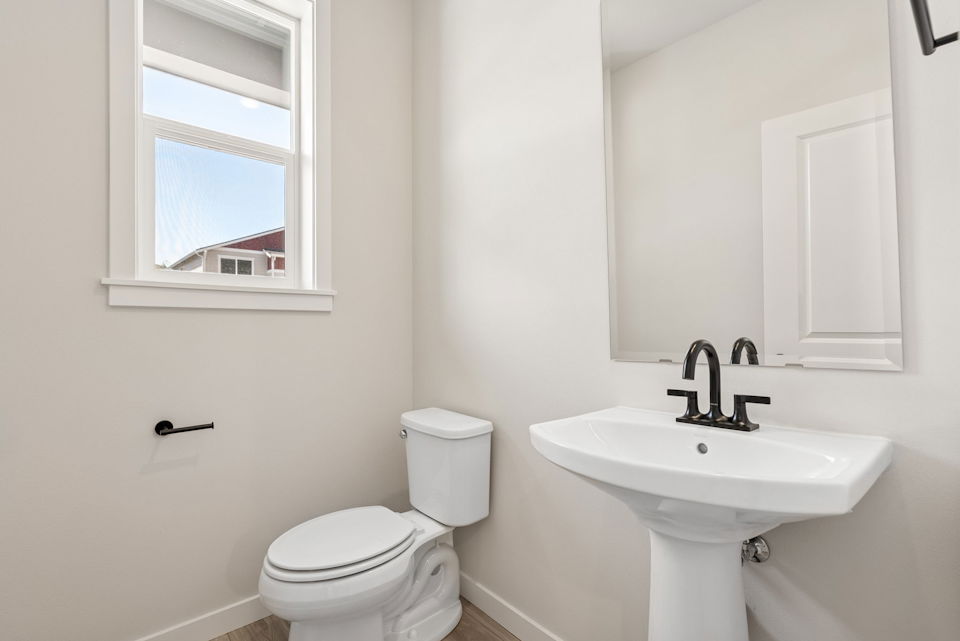 A bathroom with a toilet and sink.