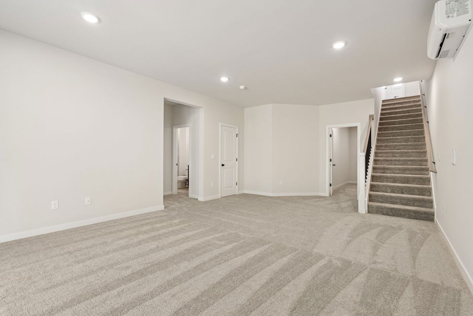 A long hallway with white walls.