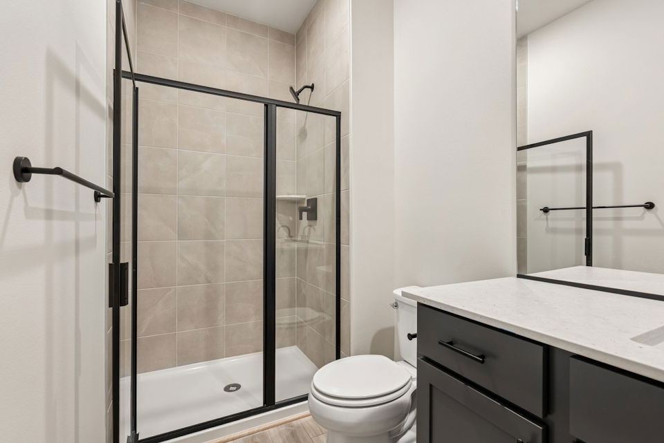 A bathroom with a glass shower.