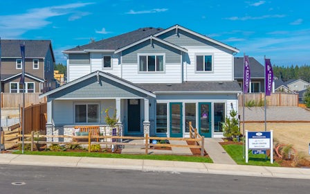 A house with a sign in front.