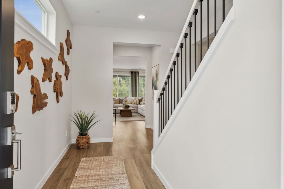 A hallway with white walls.