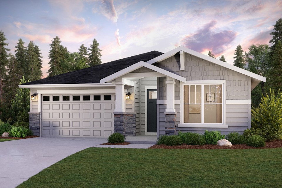 A house with a driveway and a lawn in front of it.