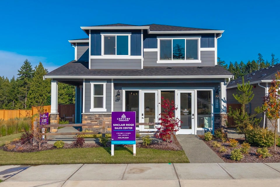 A house with a sign in front.