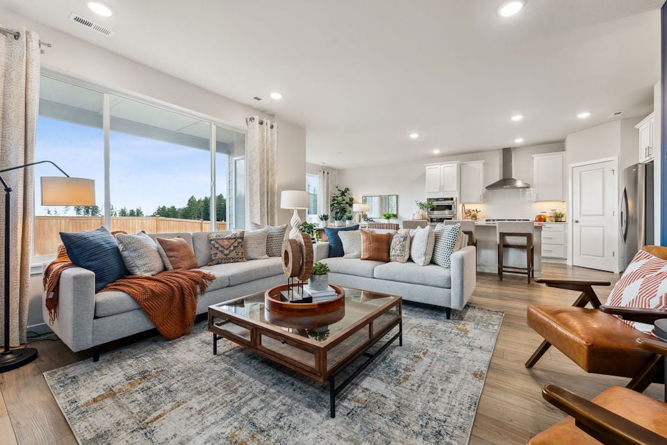A living room with a large window.